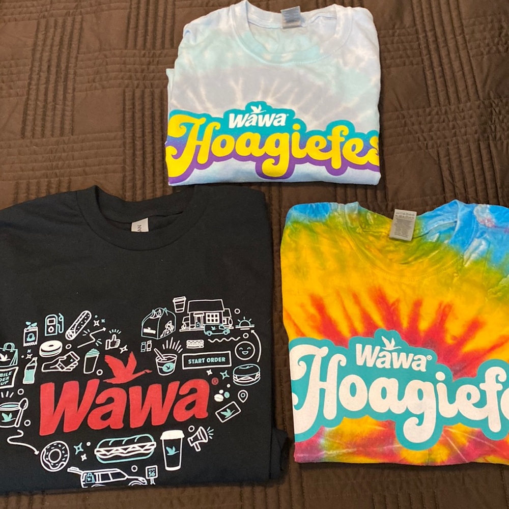Set of two tie dyed Hoagie Fest shirts and one black graphic tee.